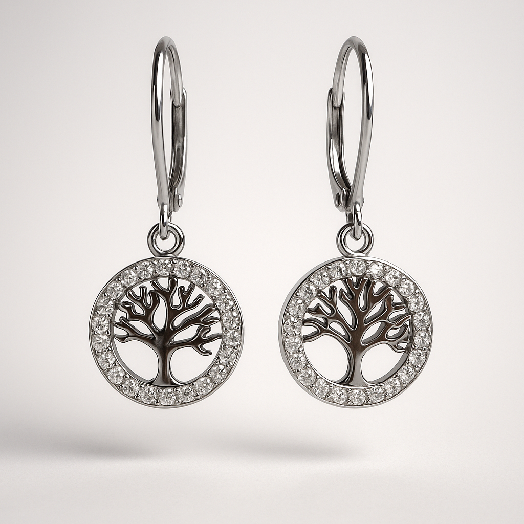 Pair of silver earrings with tree-of-life design on a light gray background